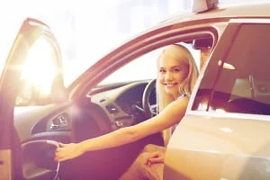 happy woman exiting vehicle