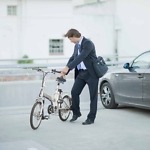 Man,Parking,His,Bicycle