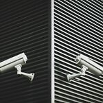 security cameras mounted to the exterior of a building.
