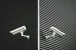 security cameras mounted to the exterior of a building.